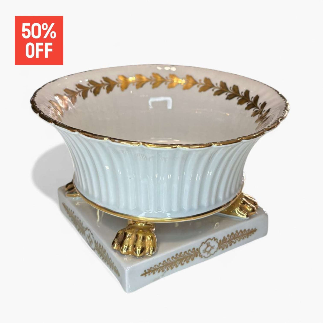 Centro de mesa de cerámica Casasus con patas de león doradas.