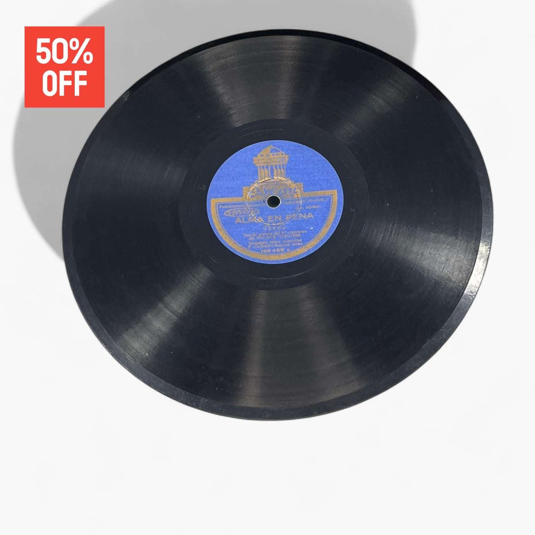 Disco de pizarra antiguo con etiqueta azul de Odeon, parte del lote de 10 discos únicos en oferta del 50%. Ideal para decoración vintage.