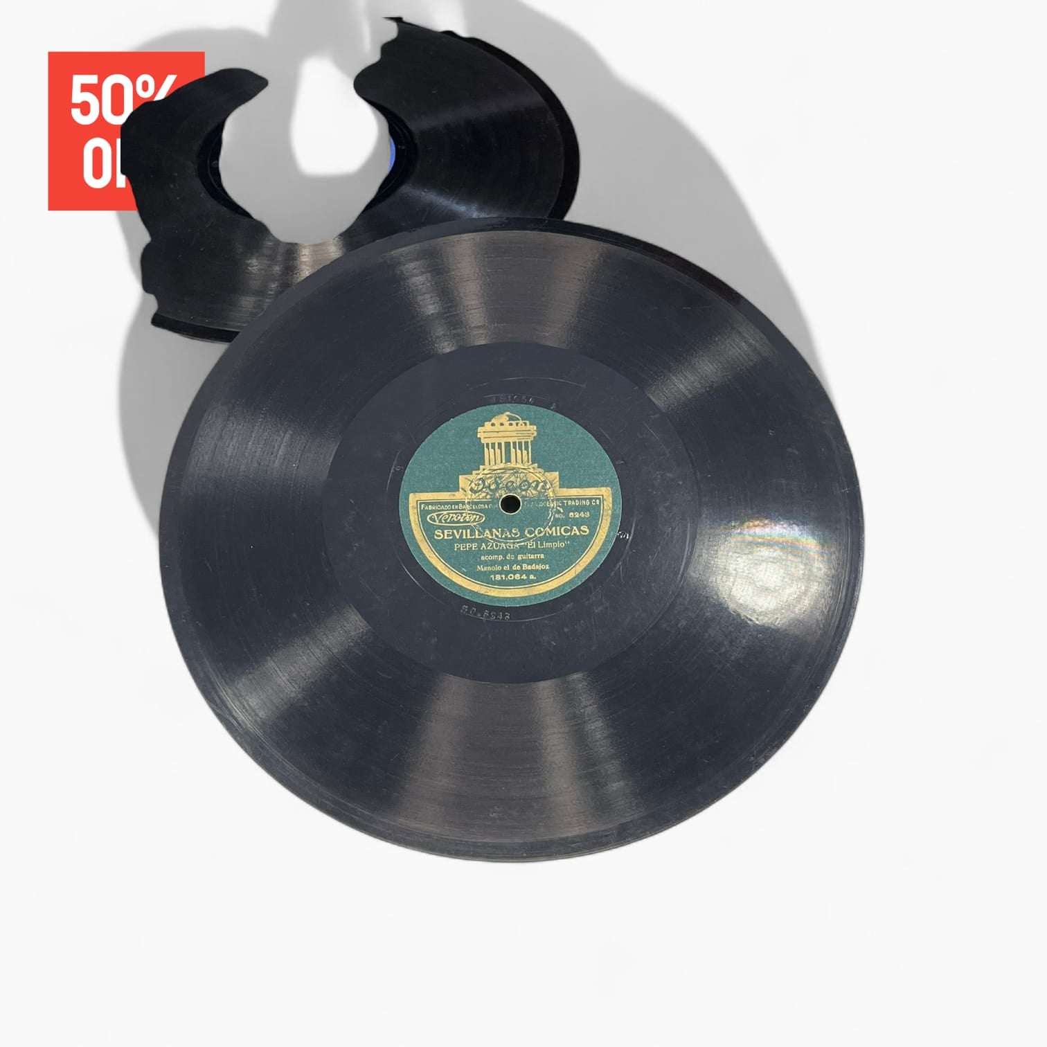 Disco de pizarra antiguo con etiqueta verde de Odeon, grabación Sevillanas Cómicas, parte del lote de 10 discos únicos en oferta.