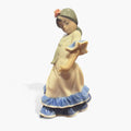 Figura decorativa Bailaorita Brazos Abajo Lladró 1983 en porcelana original, con vestido flamenco beige y azul, ideal para coleccionistas.