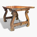 Mesa Castellana antigua con estructura robusta y detalles tallados en madera maciza. Pieza única para decoración de interiores tradicionales.
