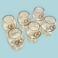 Lote de copas Napoleón de cristal con decoración dorada y emblema imperial. Juego vintage ideal para decoración elegante o regalo exclusivo.