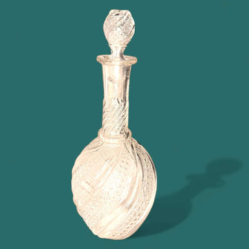 Licorera de cristal tallado con tapón decorativo