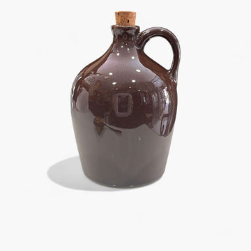 Botella de cristal con asa y tapón vintage