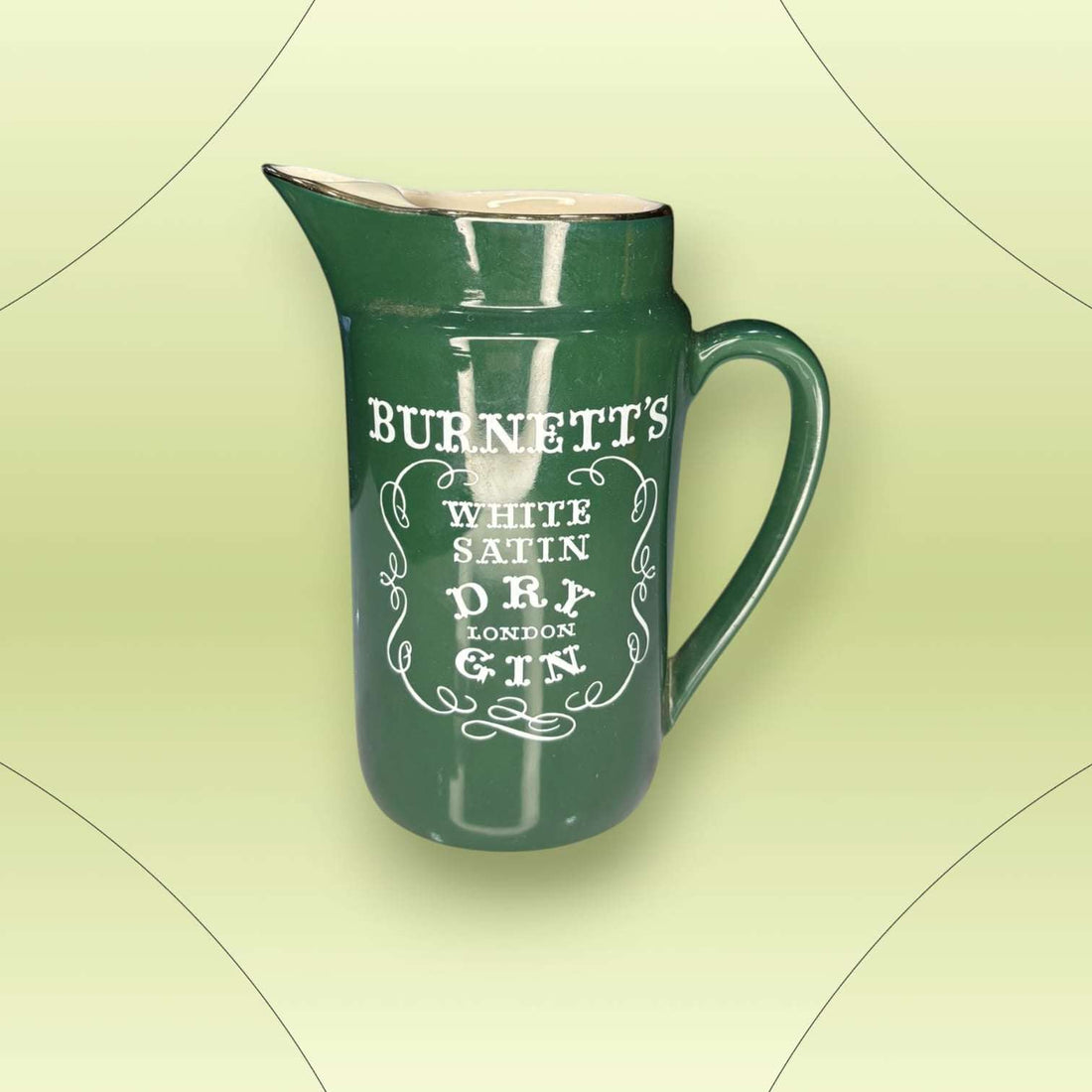 Jarra de cerámica verde Burnett’s White Satin Dry Gin con diseño clásico inglés. Ideal para decoración vintage en hogar o bar.