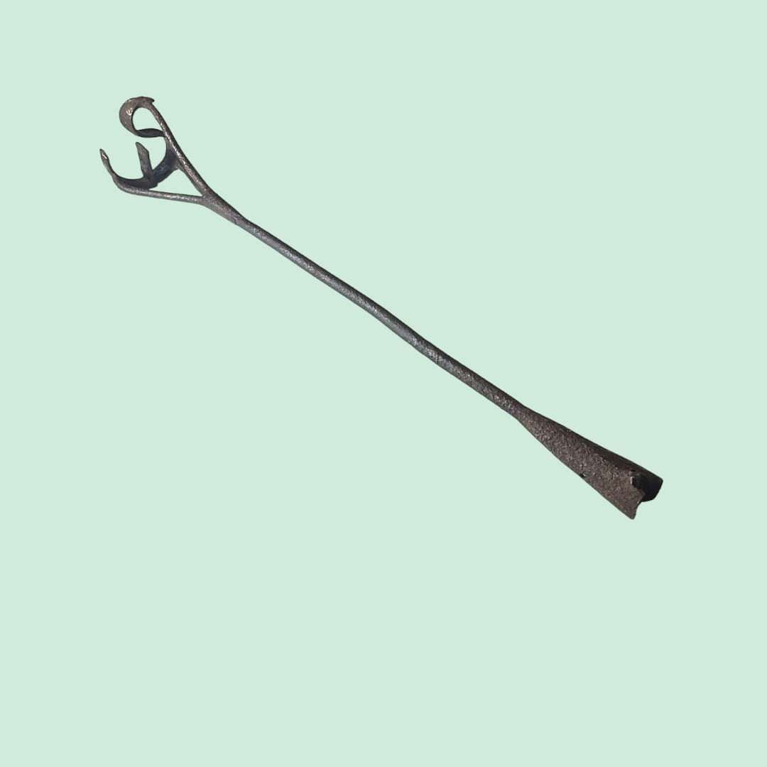 Detalle de la espiral de hierro del marcador de ganado antiguo.