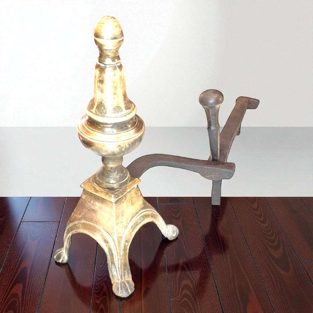 Morillo de bronce y hierro vintage con diseño clásico del siglo XIX sobre suelo de madera oscura. Decoración funcional para chimenea elegante.