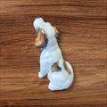 Figura lateral de perro en porcelana alemana original Limbach años 50, diseño detallado ideal para decoración vintage y coleccionistas.