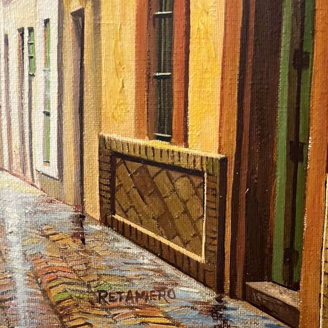 Vista frontal completa: "Cuadro al óleo firmado por Retamero, escena urbana con luz mediterránea."