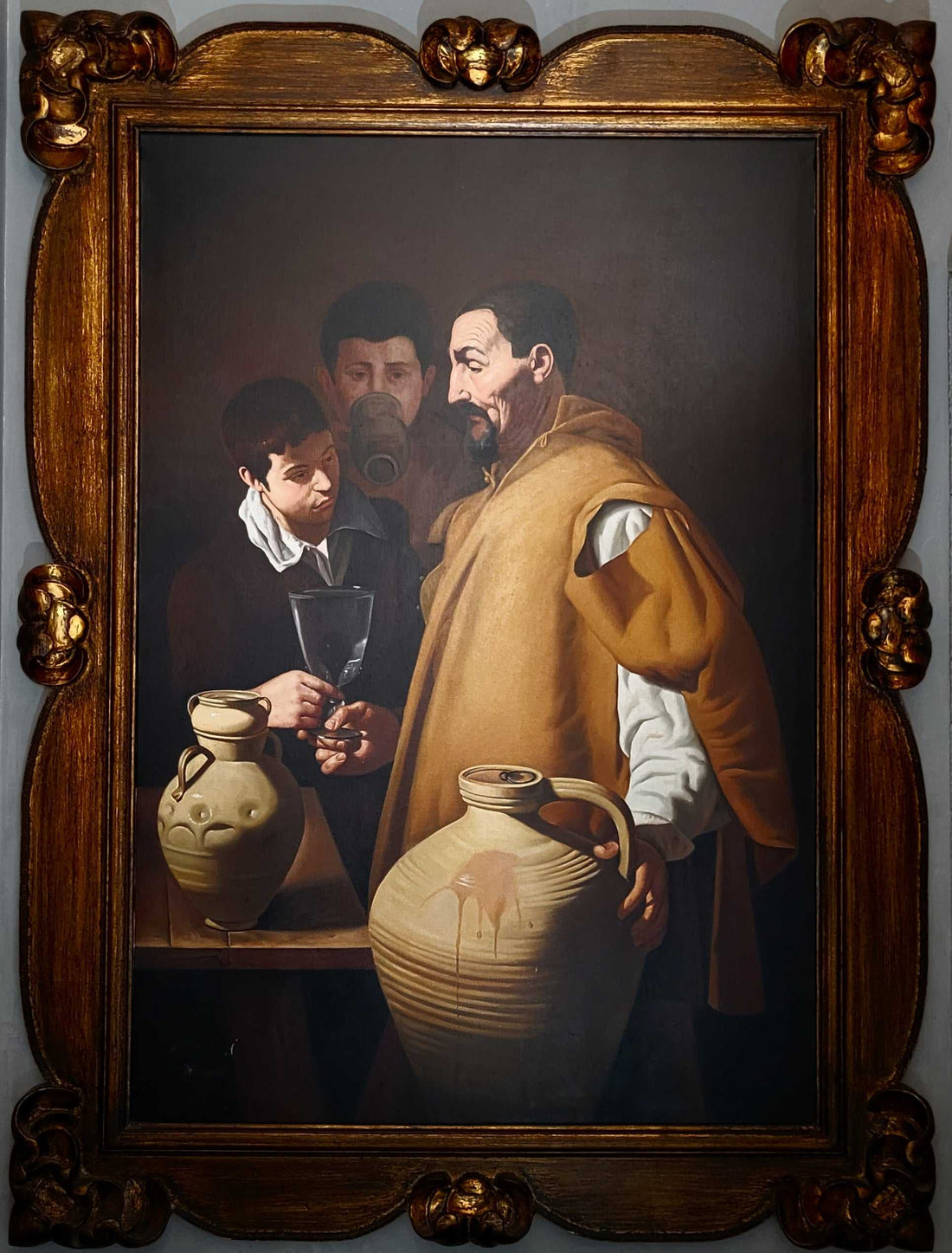 Este óleo representa la famosa obra "El Aguador de Sevilla" de Diego Velázquez, recreada por el talentoso pintor A. González.