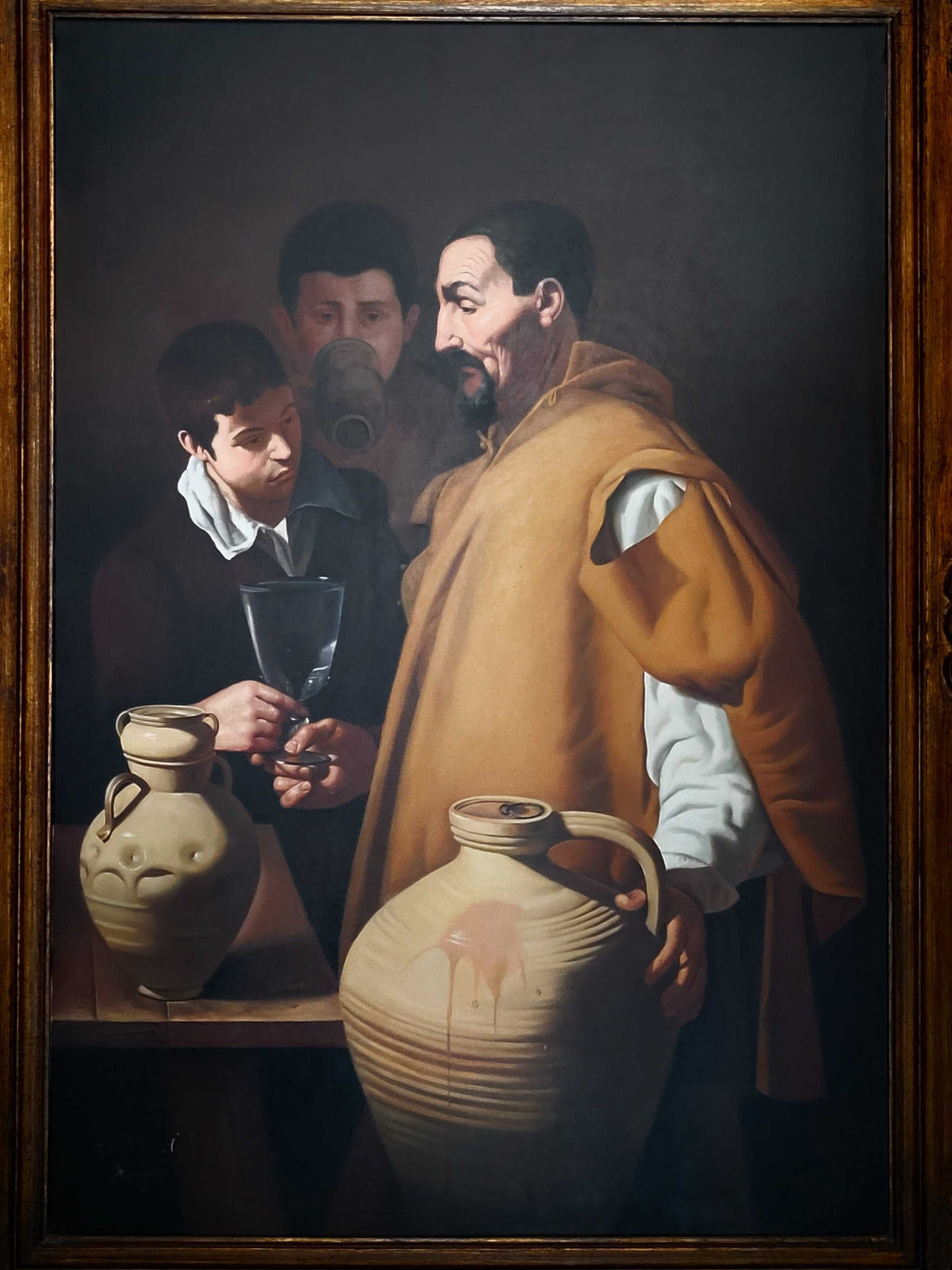 Este óleo representa la famosa obra "El Aguador de Sevilla" de Diego Velázquez, recreada por el talentoso pintor A. González.