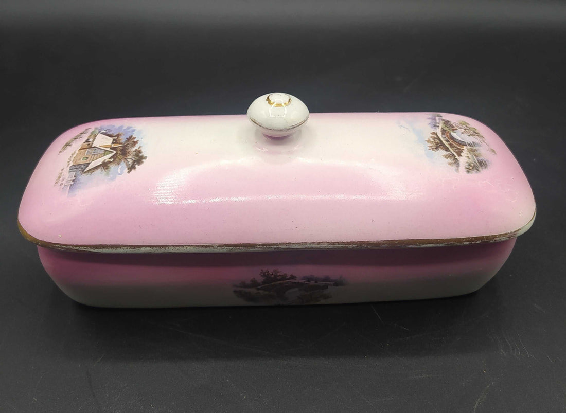 Palangana de porcelana rosa Cartuja de Sevilla con paisajes pintados, ideal para decoración vintage en hogar. Pieza clásica de tocador antiguo.